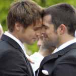 Two gay men share tender moment