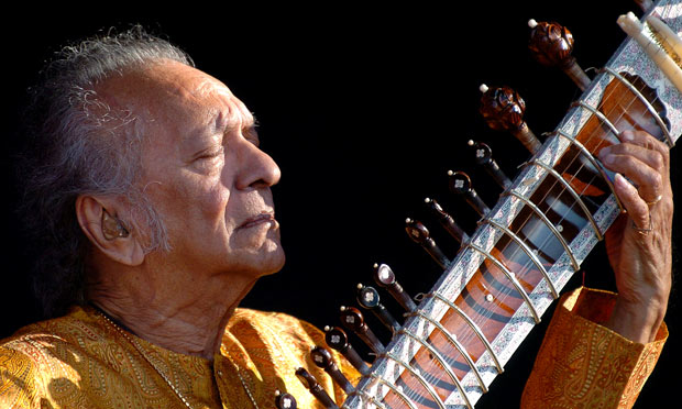An old man playing a Sitar