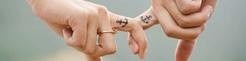 Two person holding hands after making up Two person holding hands after making up