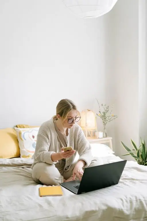 A woman receiving talking treatment in online counselling session from the comfort of her home.
